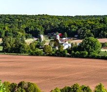 distant view of farm field and barn