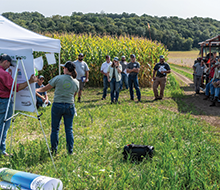 A group of people listening to a staff member